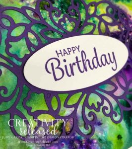 Up close look at the Happy Birthday sentiment on a Pigment Sprinkle background