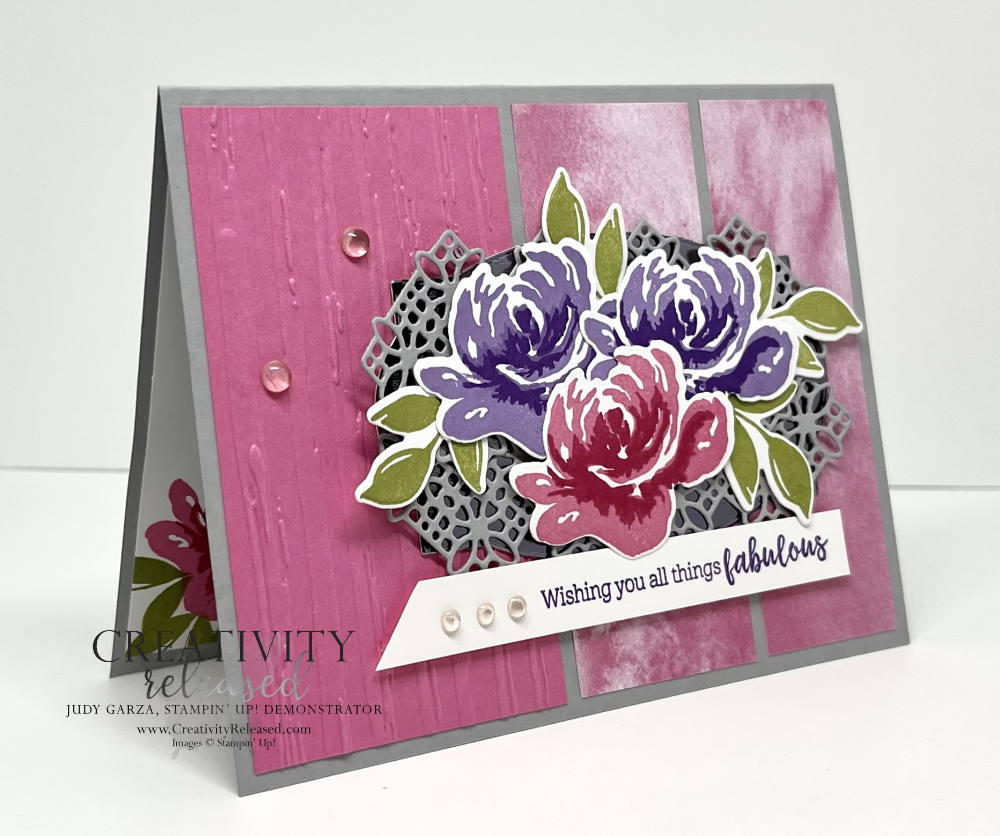 A side view of a Polished Pink and Smoky Slate (gray) card with purple and pink flowers on a background of gray lace paper. The background is three patterns with pink on a gray card base. All products by Stampin' Up!