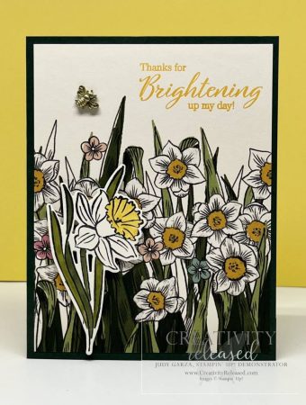 A greeting card with yellow and white Daffodils the sentiment "Thanks for Brightening up my day." It has a bumblebee trinket buzzing over the flowers. All products are by Stampin' Up!