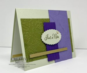 Side View of a 'Just A Note' card in greens and purples with lots of textures.