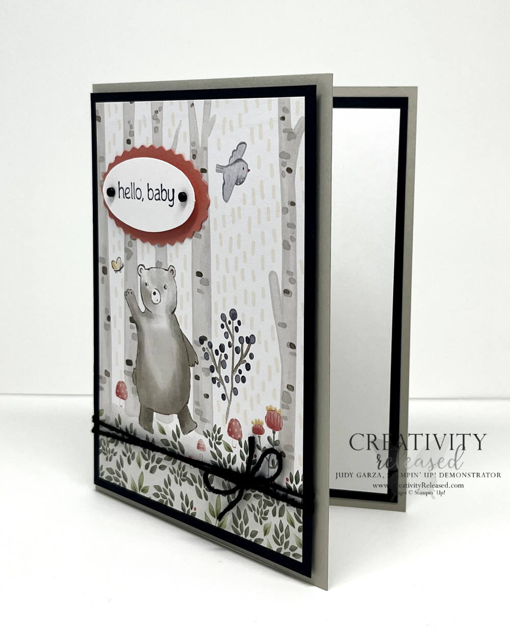 A side view of a card to welcome a new baby using the Stampin' Up! Happier Than Happy stamp set with the coordinating designer series paper. This piece features a bear in the woods.