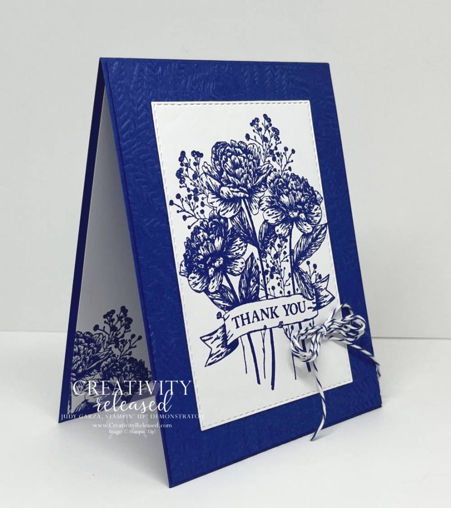 Side view of a thank you card with a bouquet of flowers stamped in Starry Sky onto Basic White then glued to the middle of a Starry Sky card base.