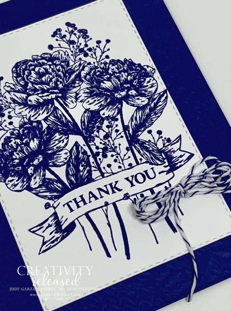 Up Close look at a thank you card with a bouquet of flowers stamped in Starry Sky onto Basic White then glued to the middle of a Starry Sky card base.