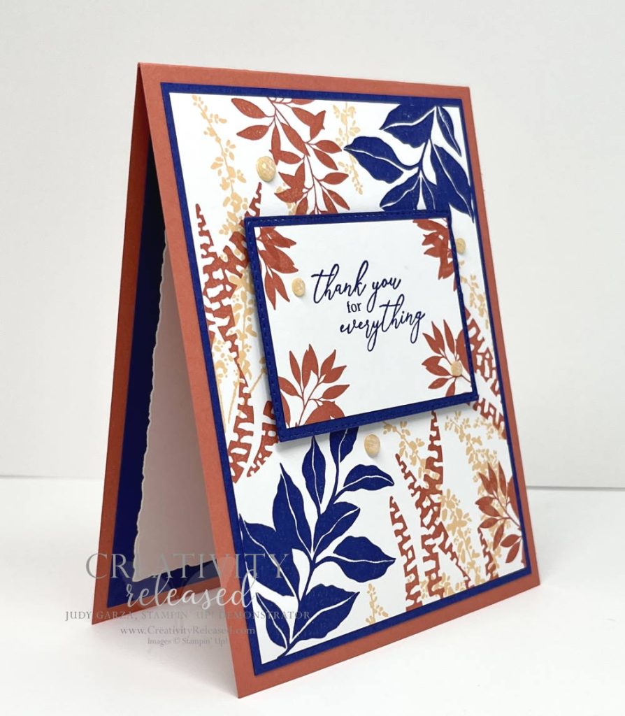 A side view of a thank you card in Calypso Coral, Starry Sky and Pale Papaya using the Botanical Layers stamp set by Stampin' Up!