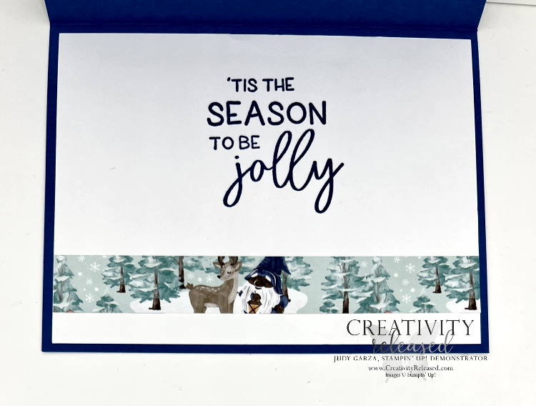 The inside of the Christmas Gnome card saying Merry Christmas standing in front of several wintry scenes.