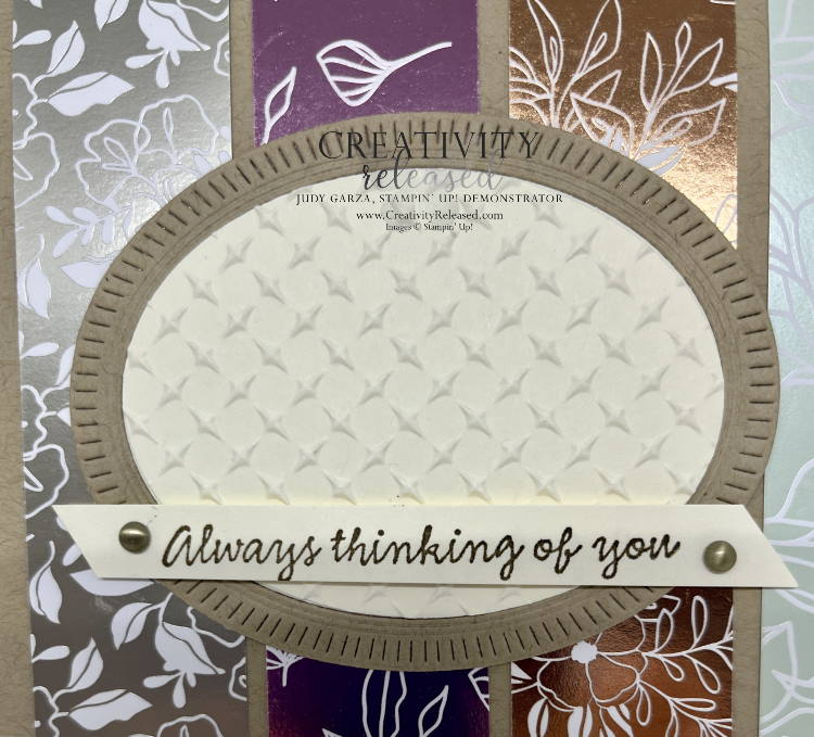 An up-close look at a card with the sentiment "Always Thinking of You," made with a Crumb Cake colored base with four strips of shiny designer series paper as the background. 