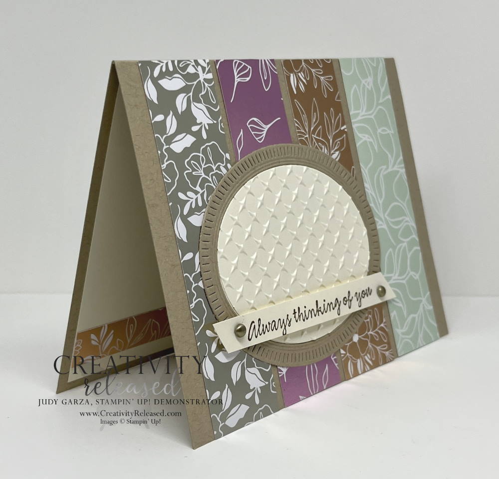 A side view of a card with the sentiment "Always Thinking of You," made with a Crumb Cake colored base with four strips of shiny designer series paper as the background. 