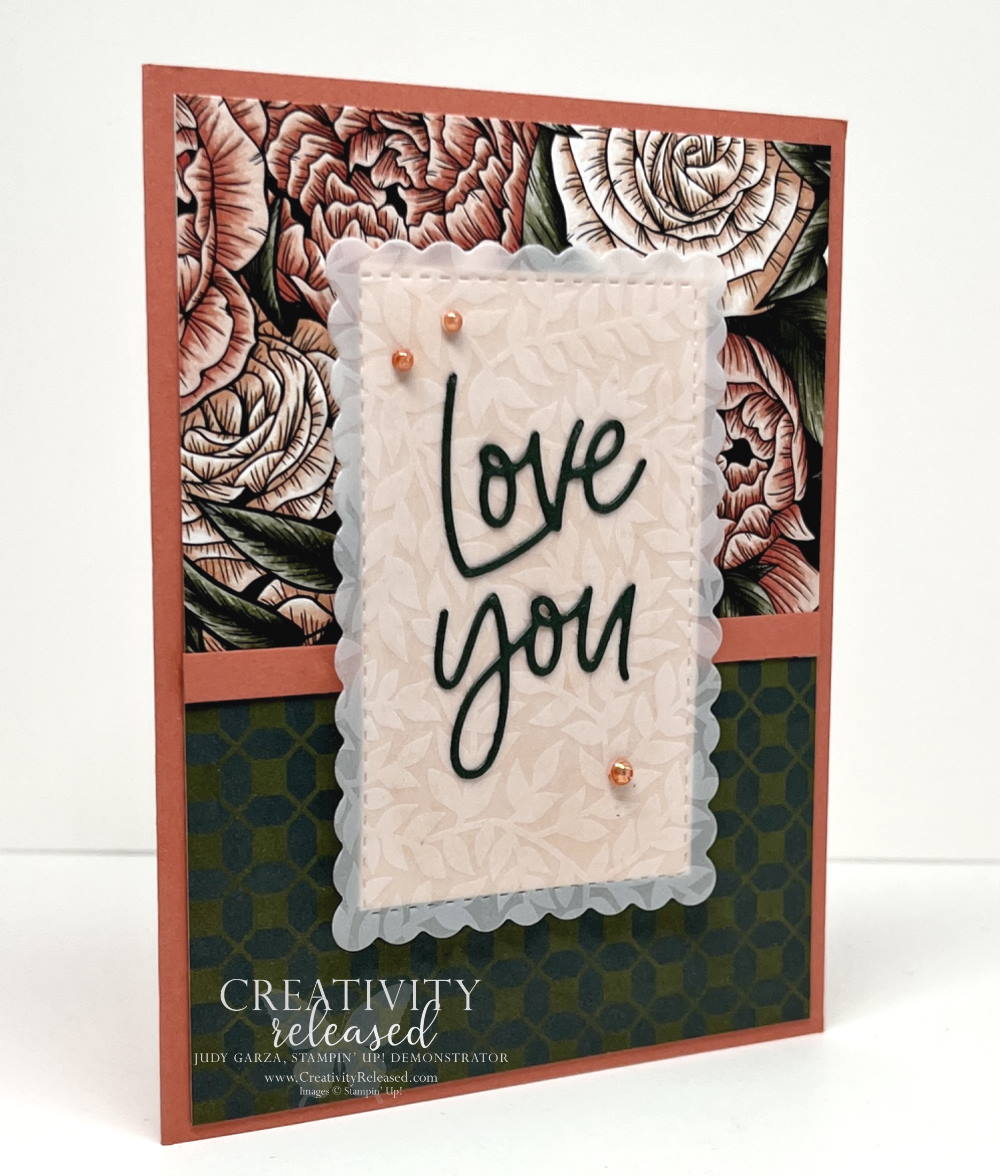 Side view of a "Love You" card made with dark greens and coral colors.