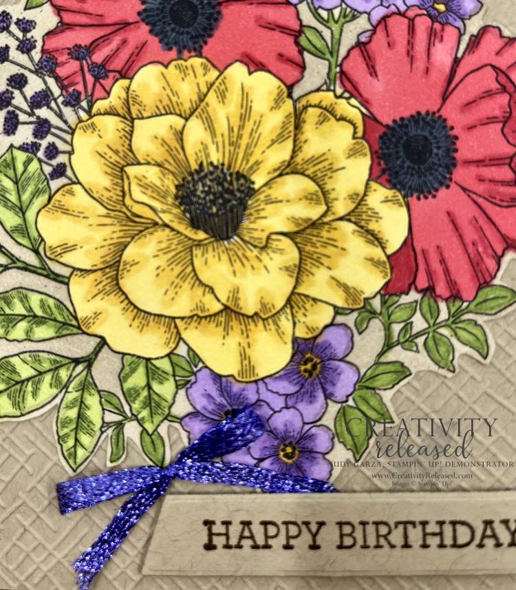 An up-close look at Abigail Rose floral designer series paper colored with Stampin' Blends, then fussy cut for the focal point on a birthday card. The flower colors are Poppy Parade, Daffodil Delight and Highland Heather.
