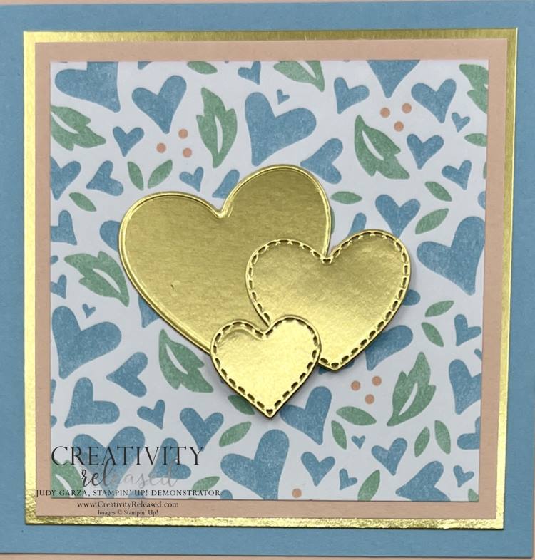 An up-close look at a Pink, Balmy Blue and gold greeting card to remind someone that they are loved.