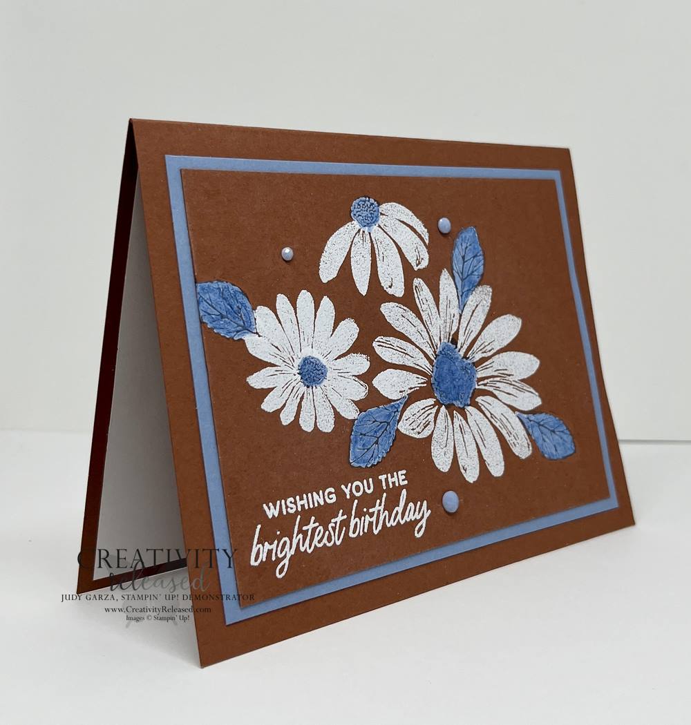 A side view of a Copper Clay, Basic White and Boho Blue Daisy birthday card for the CCMC766 Thursday Challenge.
