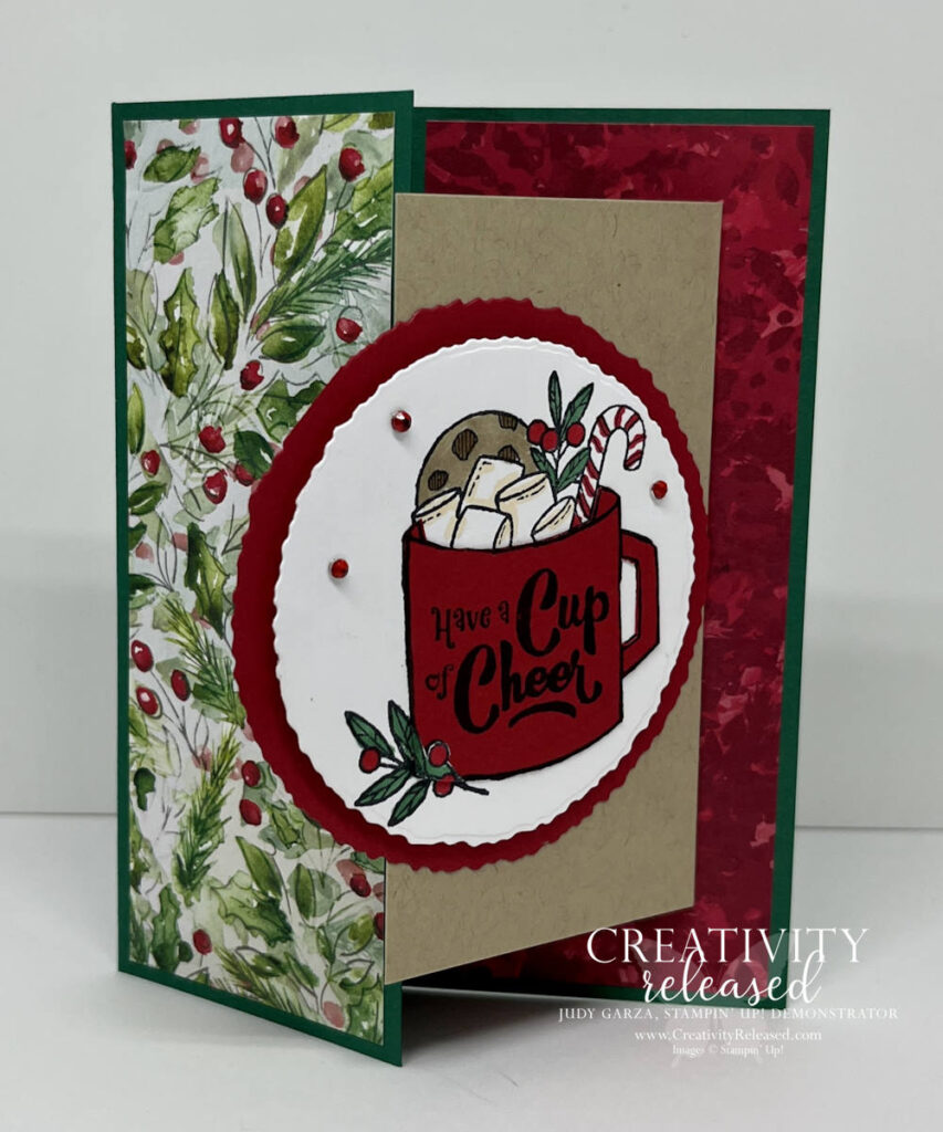 A partially open fun fold Christmas greeting card featuring a red cup filled with sweets that reads "Have a Cup of Cheer" from a Stampin' Up! stamp set.